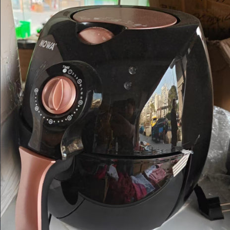 Compact black air fryer.