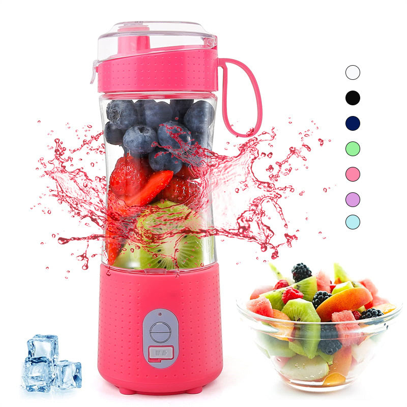 Pink portable blender with fruits inside and a bowl of fruits.