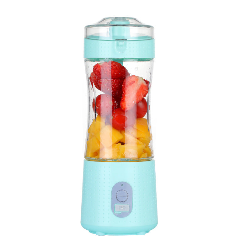 light blue portable blender with fruits inside.