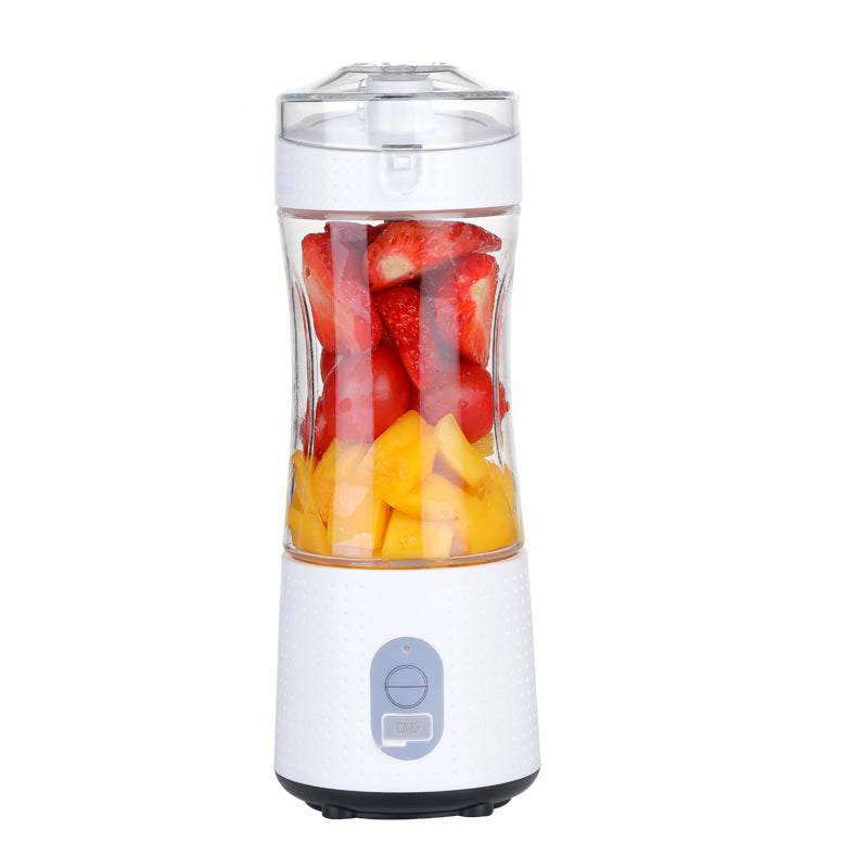 White portable blender with fruits inside.